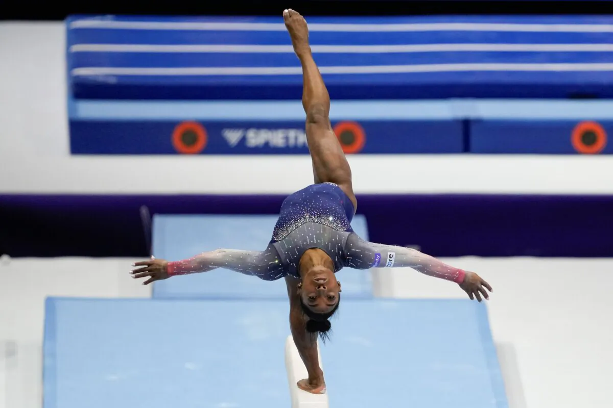 United States' Simone Biles competes on the beam during the women's team final at the Artistic Gymnastics World Championships in Antwerp, Belgium, on Oct. 4, 2023. (Virginia Mayo/AP Photo)