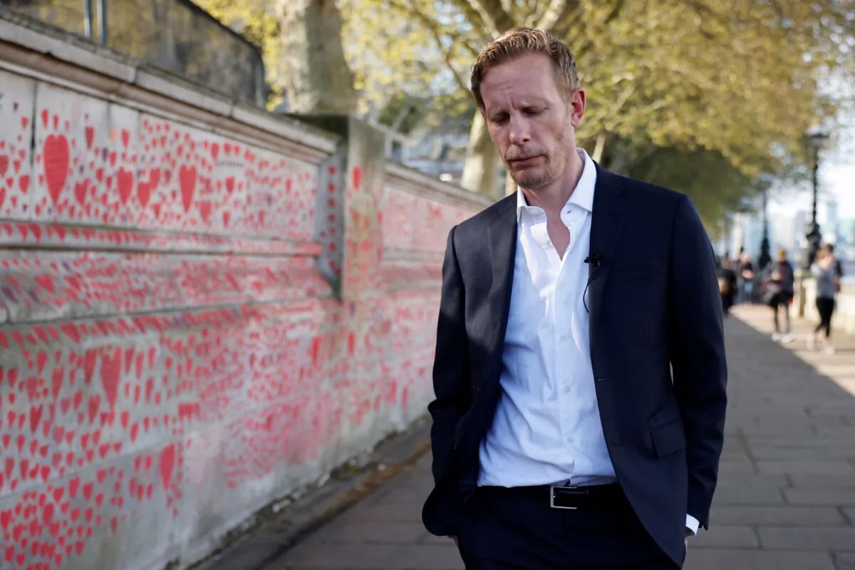 Reclaim Party leader and candidate for London mayor Laurence Fox arrives to lay a bouquet at the unveiling of a mural to highlight knife crime in London on April 30, 2021. (Tolga Akmen/AFP via Getty Images)