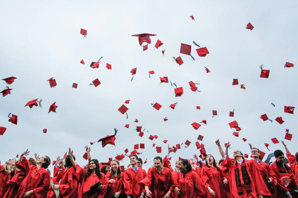 New graduates toss their hats in the air at their commencement ceremony at Wesleyan University in Middletown, Conn., on May 27, 2018. (Eduardo Munoz Alvarez/Getty Images)