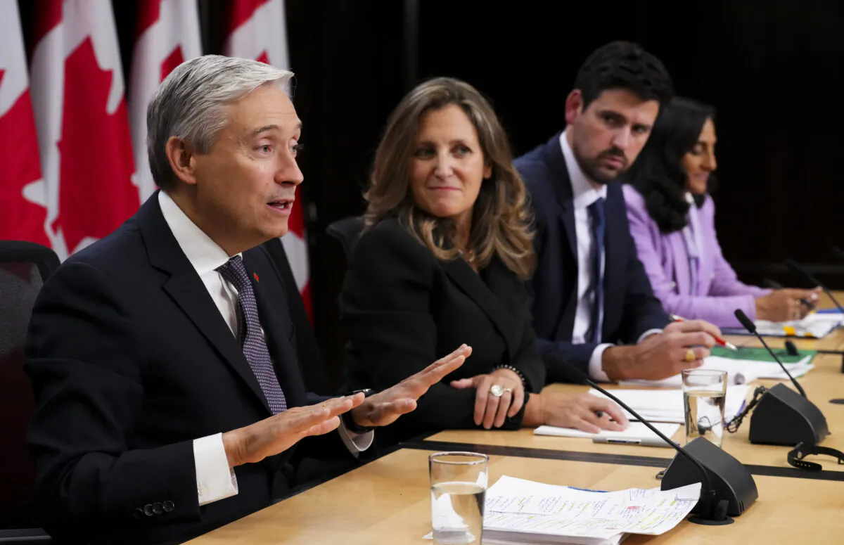 Innovation, Science and Industry Minister Francois-Philippe Champagne, Deputy Prime Minister and Minister of Finance Chrystia Freeland, Minister of Housing, Infrastructure and Communities Sean Fraser, President of the Treasury Board Anita Anand, hold a press conference in the National Press Theatre in Ottawa on Oct. 5, 2023. (Sean Kilpatrick/The Canadian Press)
