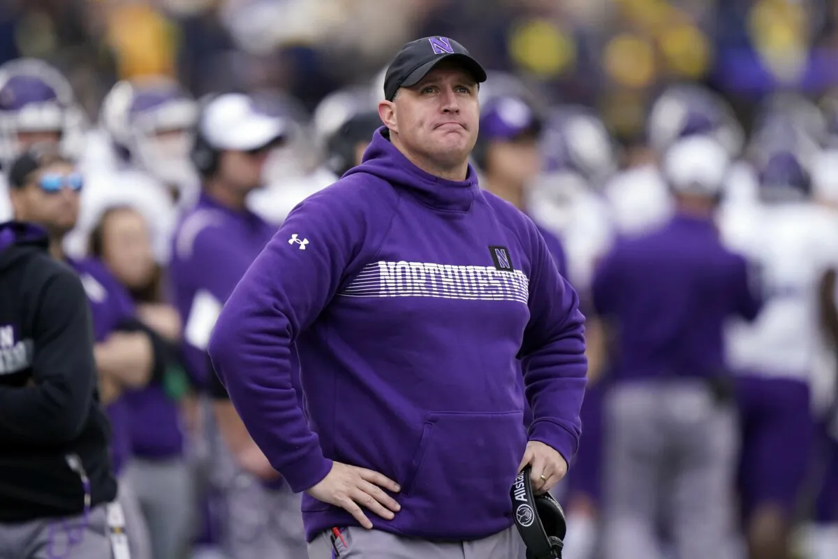 Northwestern head coach Pat Fitzgerald stands on the sideline during the first half of an NCAA college football game against Michigan in Ann Arbor, Mich., on Oct. 23, 2021. (Carlos Osorio/AP Photo)