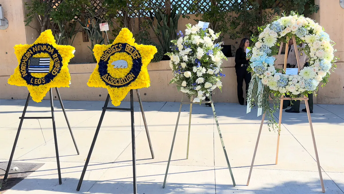 Memorials to honor deputy Ryan Clinkunbroomer is placed outside of the Cathedral of our Lady of the Angels in Los Angeles on Oct. 5, 2023. (NTD Television)