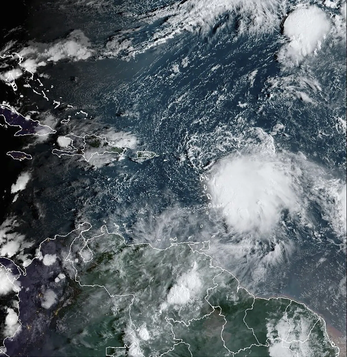 A satellite image shows Tropical Storm Philippe (center R) on Oct. 2 2023. (NOAA via AP)