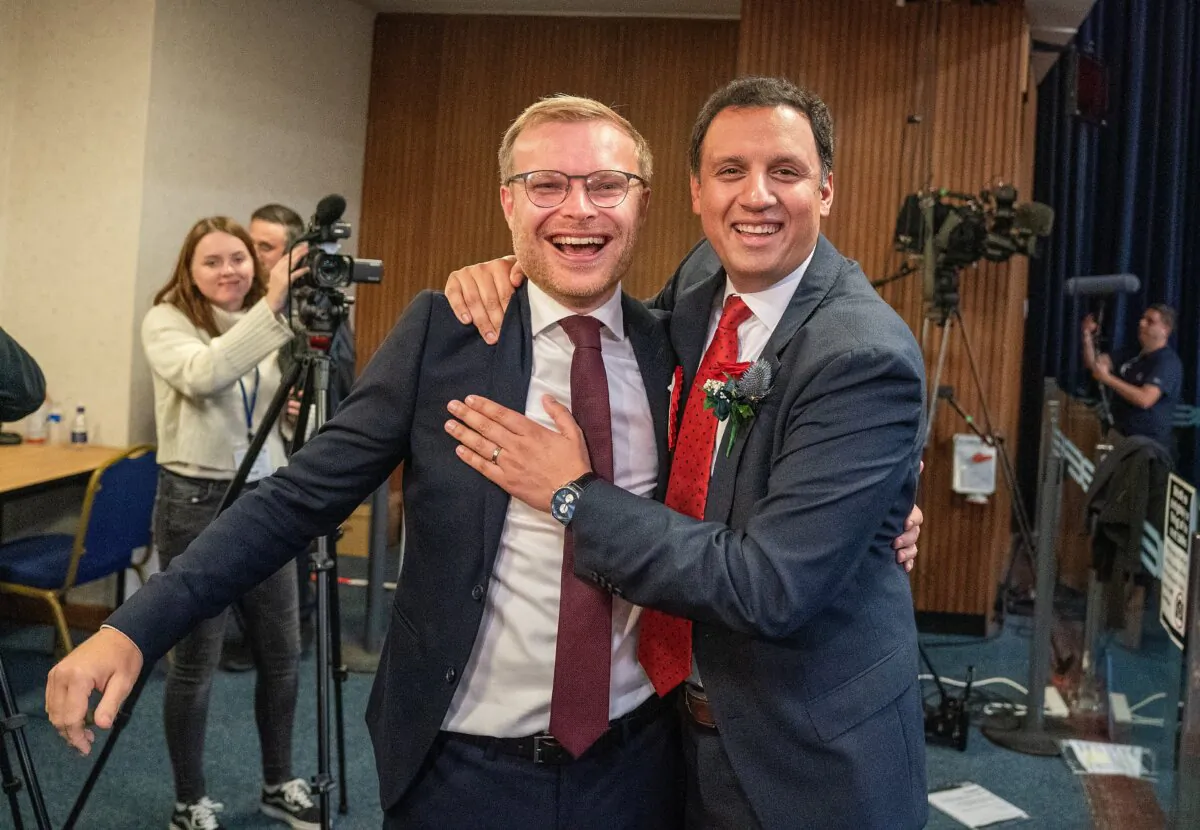 Scottish Labour leader Anas Sarwar (R) with candidate Michael Shanks after Labour won the Rutherglen and Hamilton West by-election, at South Lanarkshire Council Headquarters in Hamilton, England, on Oct. 6, 2023. (Jane Barlow/PA)