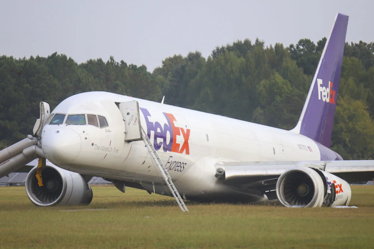 A FedEx 757 sits on a landing strip at the Chattanooga Metropolitan Airport on Oct. 5, 2023, after crash landing late Wednesday evening. (Olivia Ross/Chattanooga Times Free Press via AP)