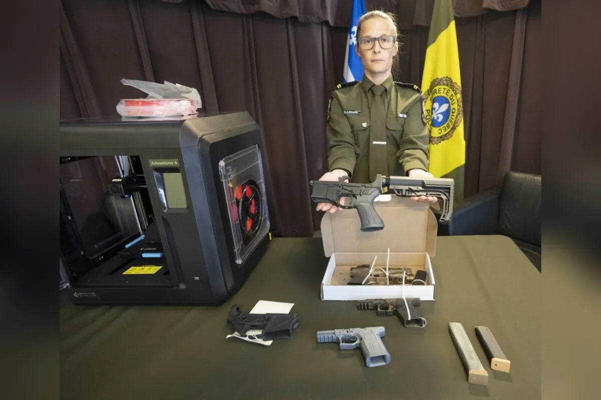 Quebec provincial police Sgt. Audrey-Ane Bilodeau shows some of the 3D-printed ghost guns seized in Operation Centaure during a news conference in Montreal, on June 21, 2023. (The Canadian Press/Ryan Remiorz)
