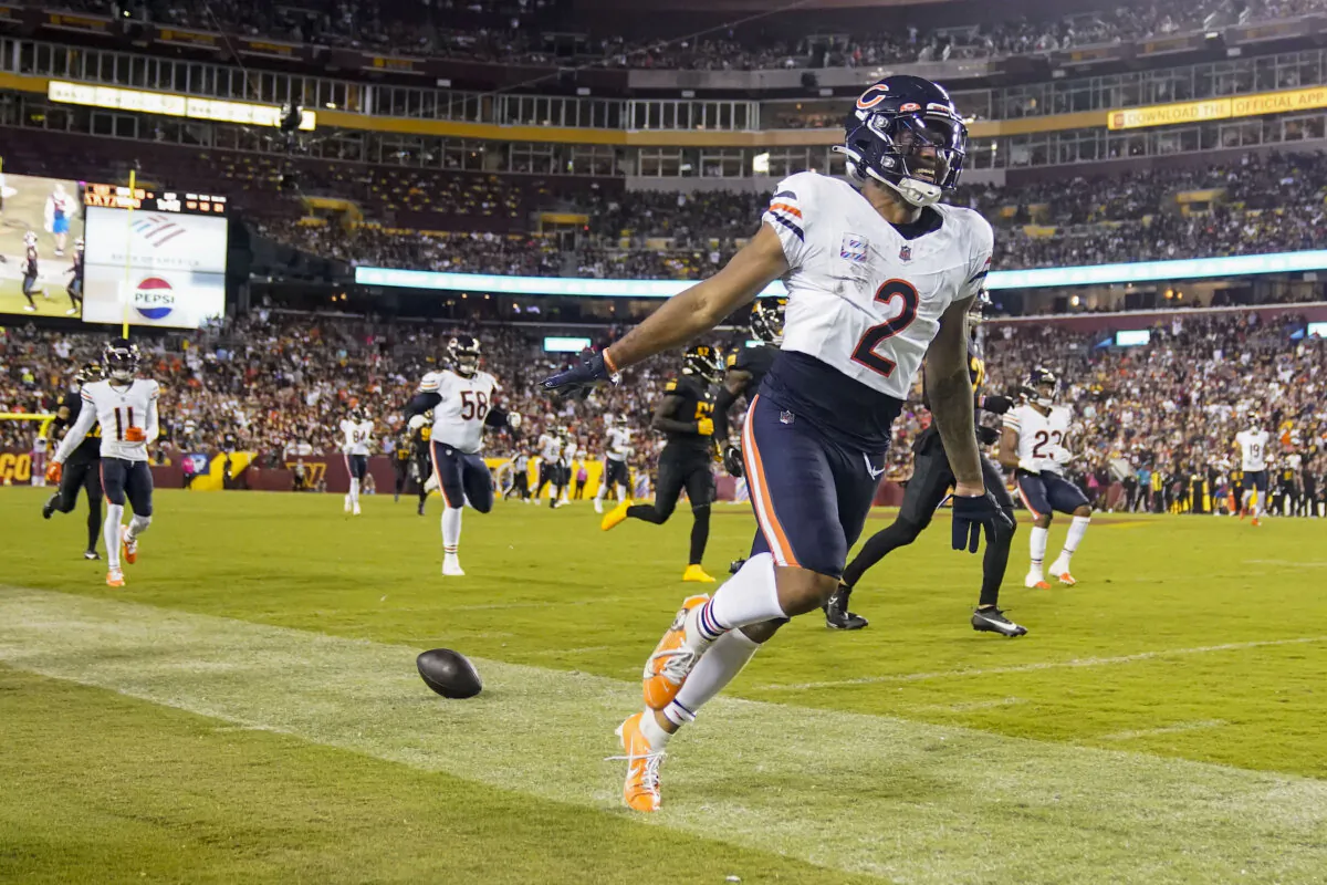 Chicago Bears wide receiver DJ Moore (2) smiles after stepping out of bounds during the first half of an NFL football game against the Washington Commanders in Landover, Md., on Oct. 5, 2023. (Alex Brandon/AP Photo)