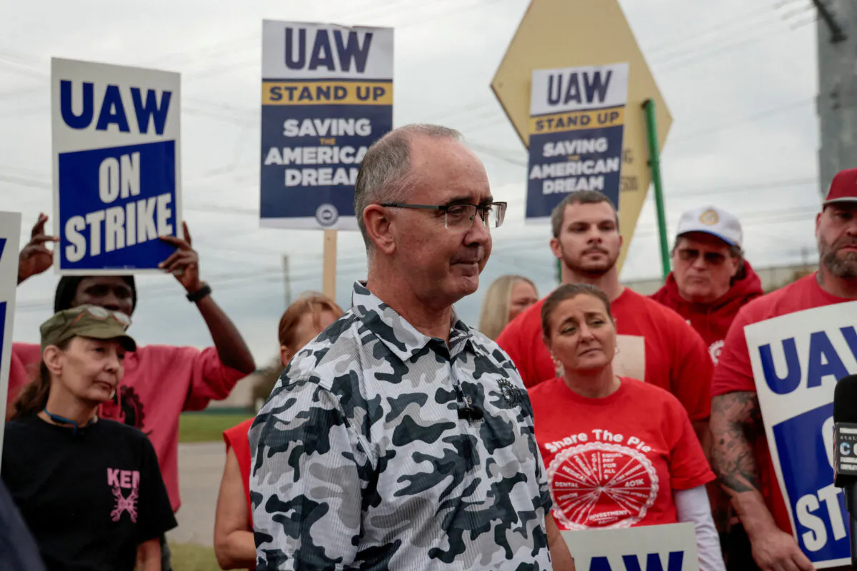 Striking United Auto Workers members from the General Motors Lansing Delta Plant picket on a street corner in Delta Township, Mich., on Sept. 29, 2023. (Rebecca Cook/Reuters)