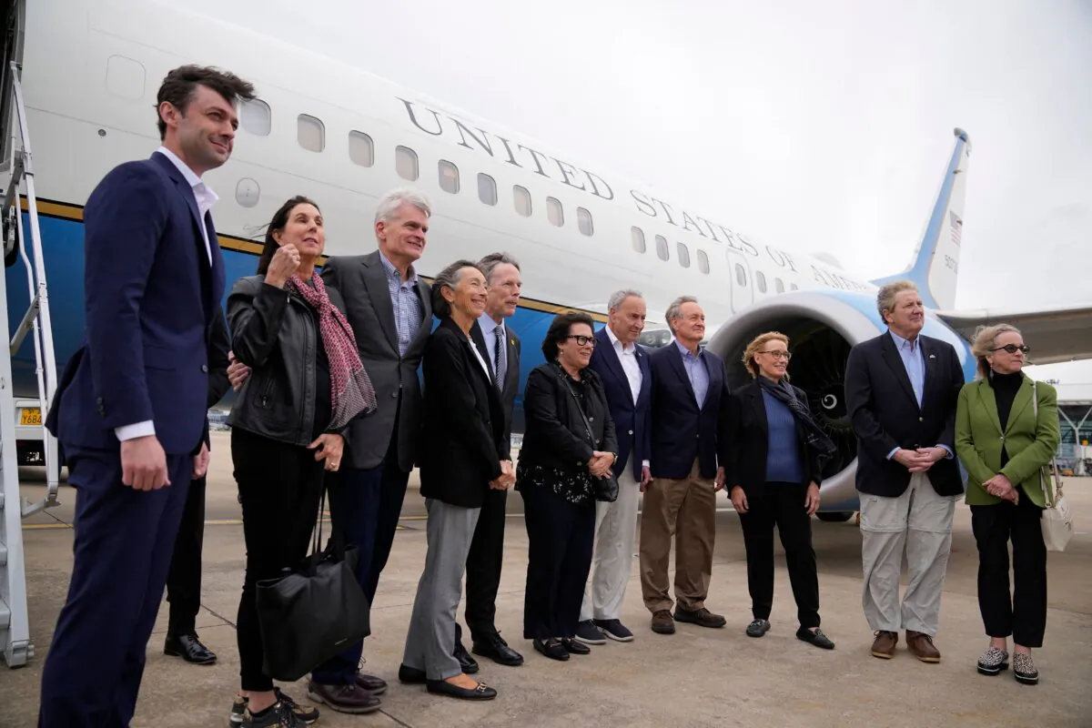 U.S. Senate Majority Leader Chuck Schumer (D-N.Y.) and other members of the delegation arrive at Shanghai Pudong International Airport in Shanghai on Oct. 7, 2023. (Aly Song/AFP via Getty Images)