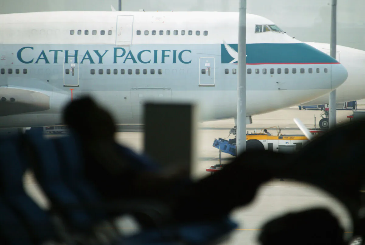 Cathay Pacific airplanes stand on the tarmac of Chek Lap Kok airport April 16, 2003 in Hong Kong, China.(Christian Keenan/Getty Images)