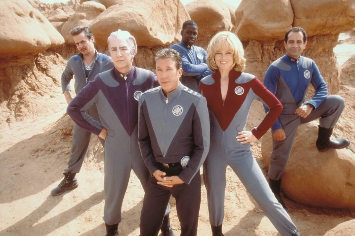 Crew of “Galaxy Quest” TV series (L–R): Guy Fleegman (Sam Rockwell), Alexander Dane (Alan Rickman), Jason Nesbith (Tim Allen), Tommy Webber (Daryl Mitchell), Gwen DeMarco (Sigourney Weaver), and Fred Kwan (Tony Shalhoub), in “Galaxy Quest.” (Dreamworks Pictures)