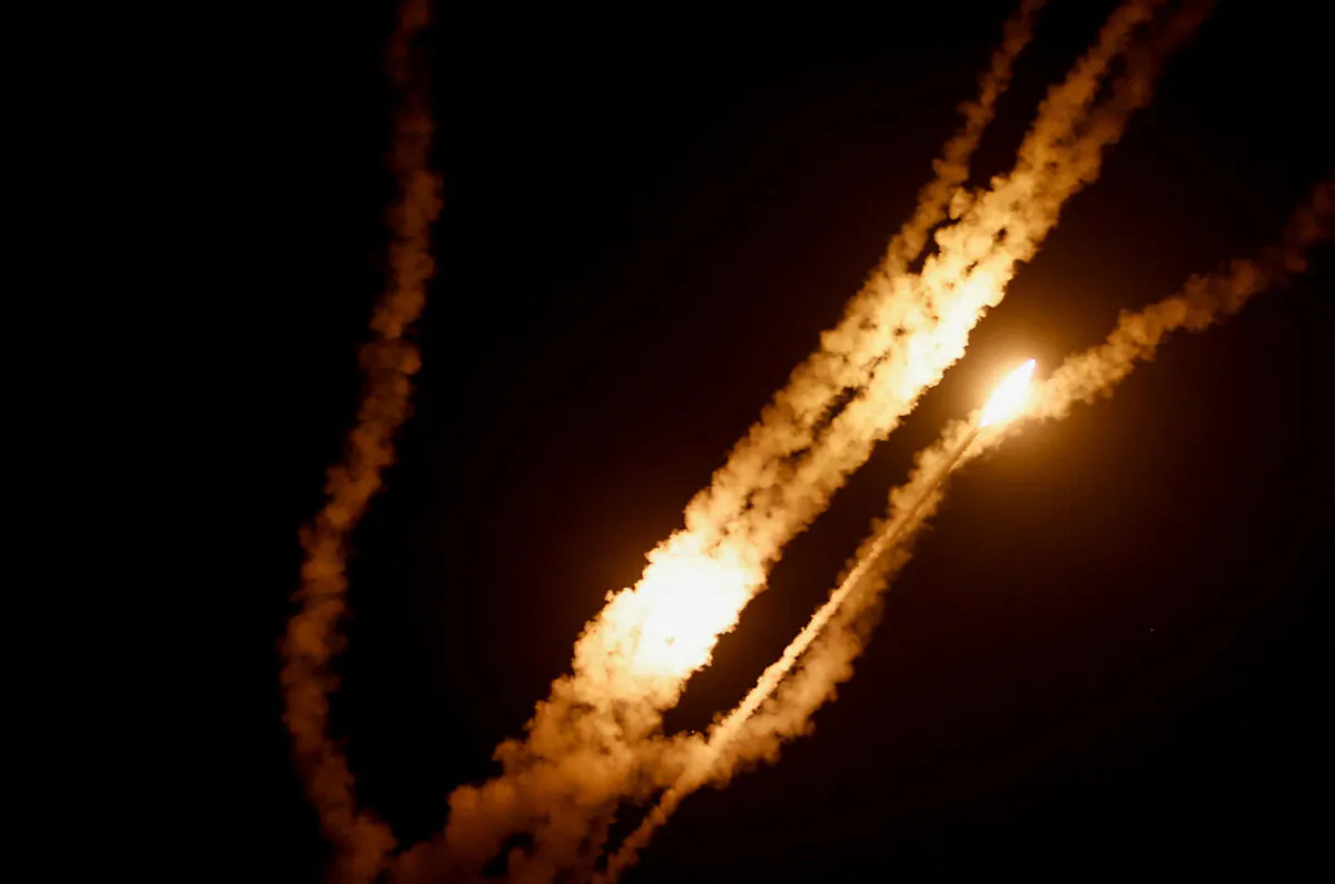 A rocket is fired from Gaza toward Israel, in Gaza, Oct. 7, 2023. (Ibraheem Abu Mustafa/Reuters)