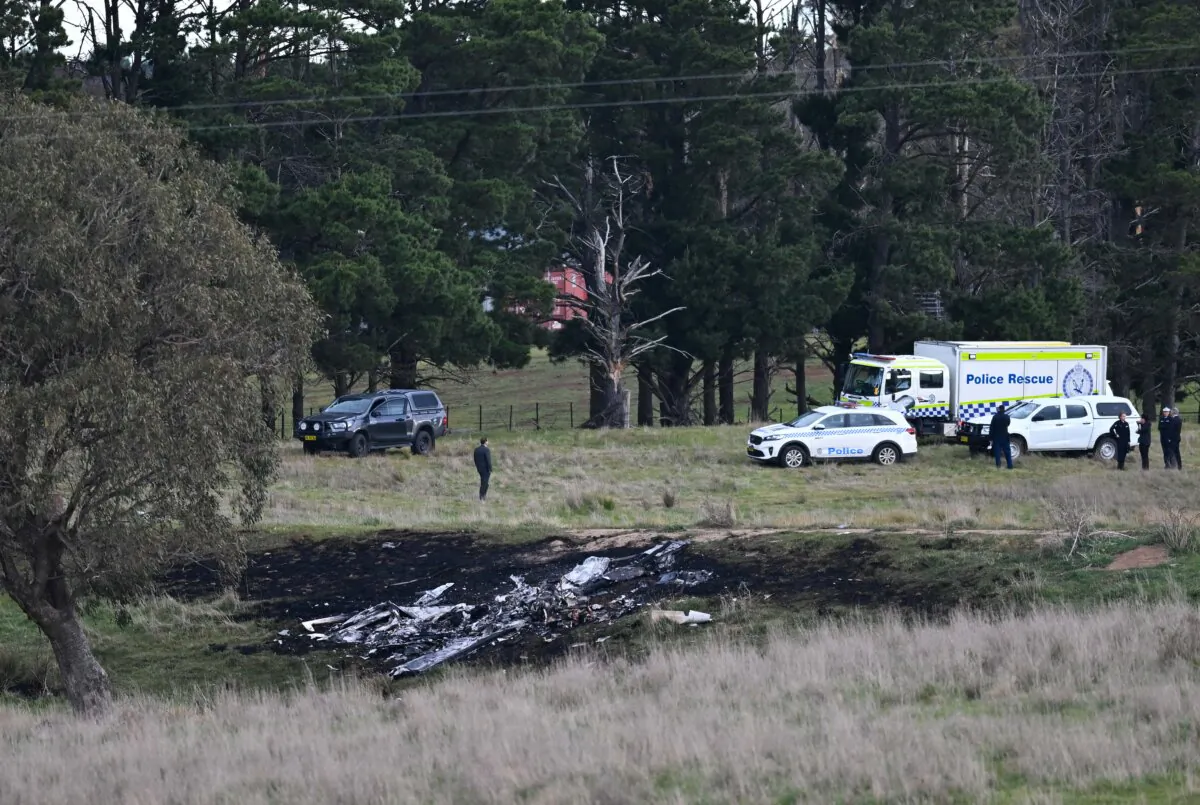 Debris is seen at the site of a light aircraft crash in Gundaroo, NSW, Friday, Oct. 6, 2023. (AAP Image/Lukas Coch)