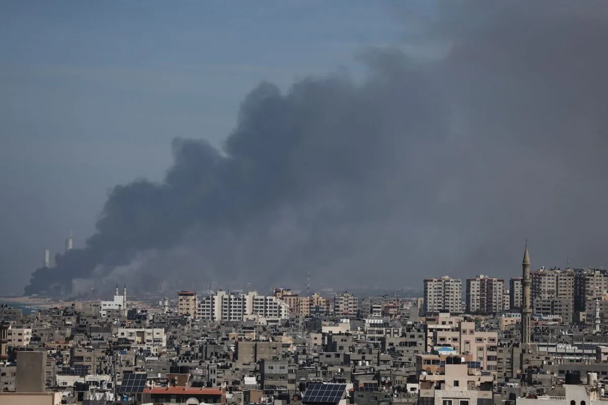 Smoke billows over the Israeli side of the border with Gaza following a series of early morning rocket attacks from the Gaza Strip into Israel, on Oct. 7, 2023. (Mohammed Abed/AFP via Getty Images)