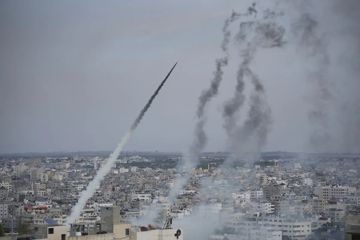Rockets are launched by Hamas terrorists from the Gaza Strip toward Israel, in Gaza on Oct. 7, 2023. (AP Photo/Hatem Moussa)