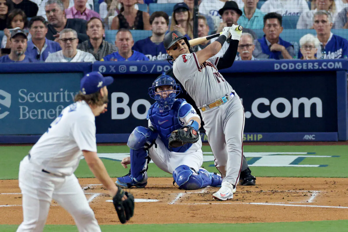 Gabriel Moreno (14) of the Arizona Diamondbacks hits a home run off Clayton Kershaw (22) of the Los Angeles Dodgers in the first inning during Game One of the Division Series at Dodger Stadium in Los Angeles on Oct. 7, 2023. (Kevork Djansezian/Getty Images)
