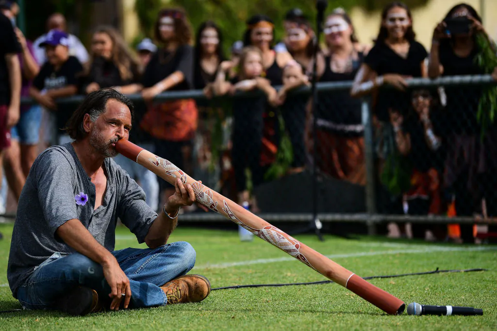 A didgeridoo player performs during the 2020 AFLW Round 03 match between the Fremantle Dockers and the Collingwood Magpies at Fremantle Oval in Fremantle, Australia, on Feb. 22, 2020. (Daniel Carson/AFL Photos via Getty Images)