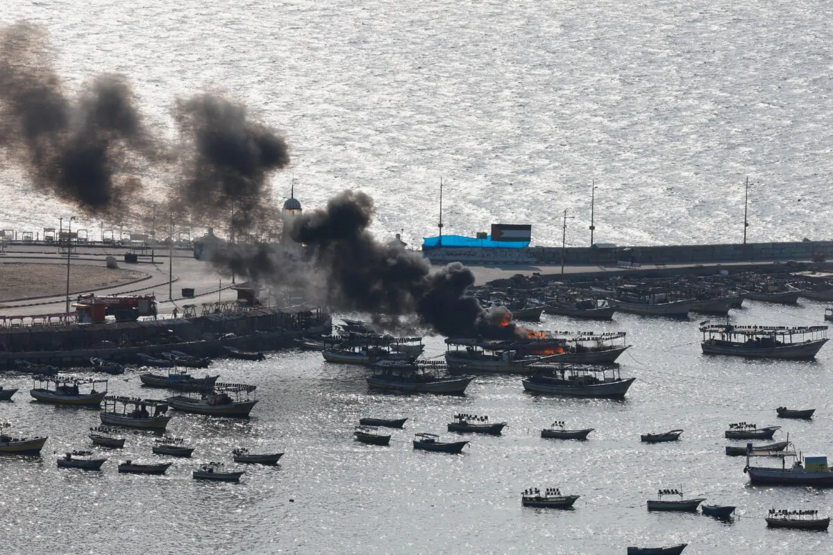 Smoke billows from a boat following Israeli strikes, at Port of Gaza, on Oct. 8, 2023. (Mohammed Salem/Reuters)