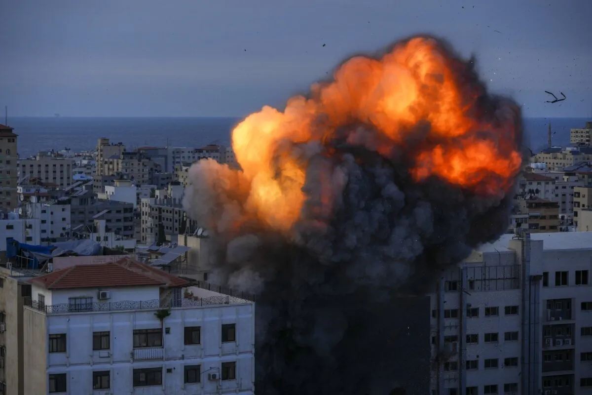 Fire and smoke rise following an Israeli airstrike on Hamas targets in Gaza City on Oct. 8, 2023. (The Canadian Press/AP/Hatem Moussa)