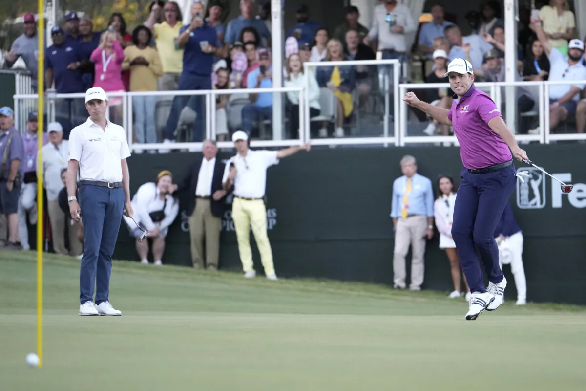 Luke List of the United States reacts while watching his putt as Ben Griffin looks on during the first playoff hole of the final round of the Sanderson Farms Championship at The Country Club of Jackson in Jackson, Miss., on Oct. 8, 2023. (Raj Mehta/Getty Images)