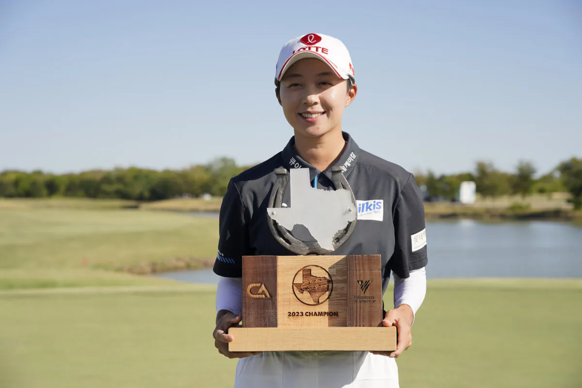 Hyo Joo Kim of South Korea celebrates with the trophy after winning during the final round of The Ascendant LPGA benefiting Volunteers of America at Old American Golf Club at The Colony, Texas, on Oct. 8, 2023. (Sam Hodde/Getty Images)