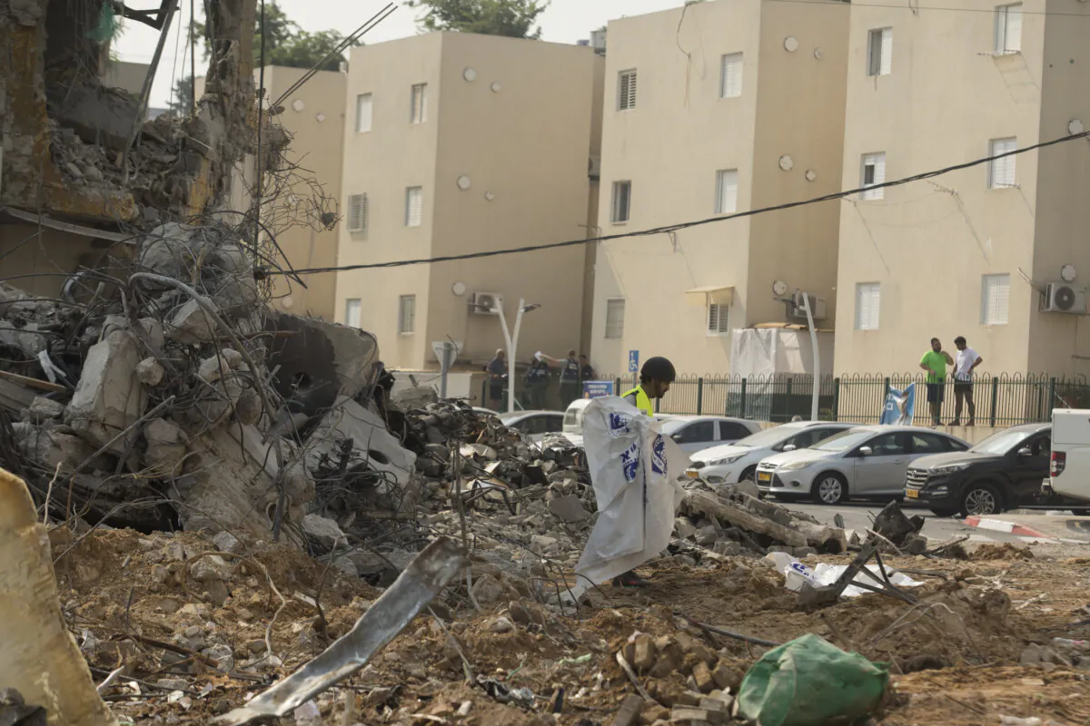 Israeli rescue member works at a police station in the Israeli community of Sderot, Israel, on Oct. 8, 2023, after it was destroyed during an ambush by Hamas terrorists the previous day. (Amir Levy/Getty Images)