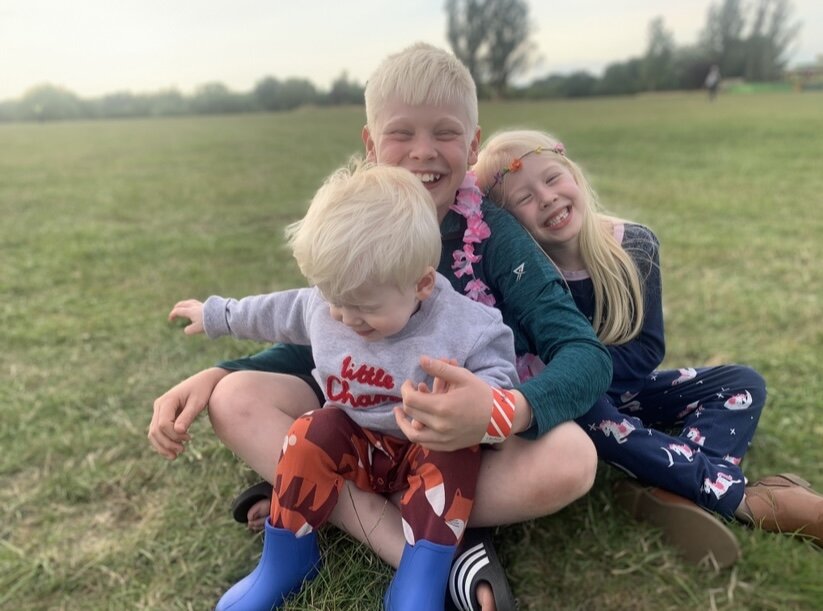 Archie with his siblings.