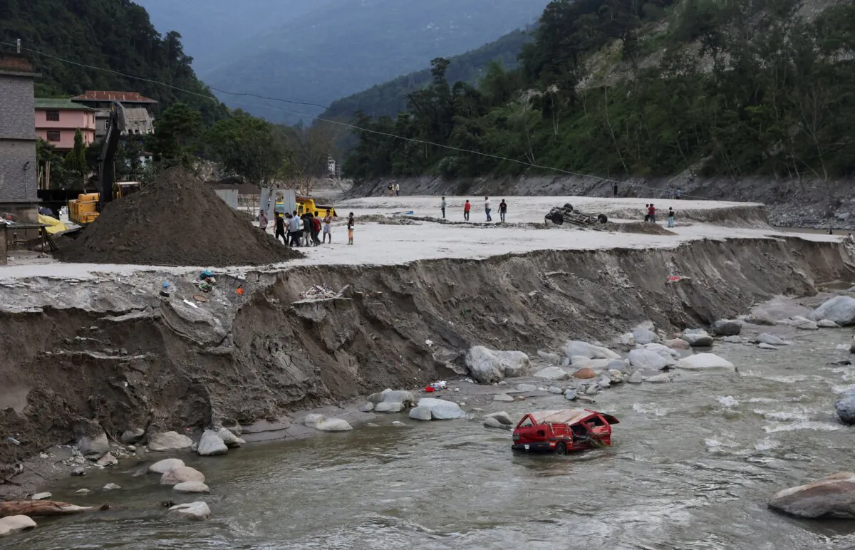 A damaged vehicles after flash floods, caused by a lake burst in Singtam, Sikkim, India, on Oct. 8, 2023. (Francis Mascarenhas/Reuters)