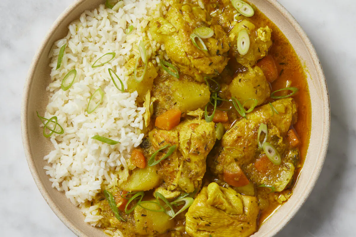 This recipe for curry chicken uses Jamaican curry powder and bone-in, skin-on chicken for the best flavor. (Alex Lepe/TNS)