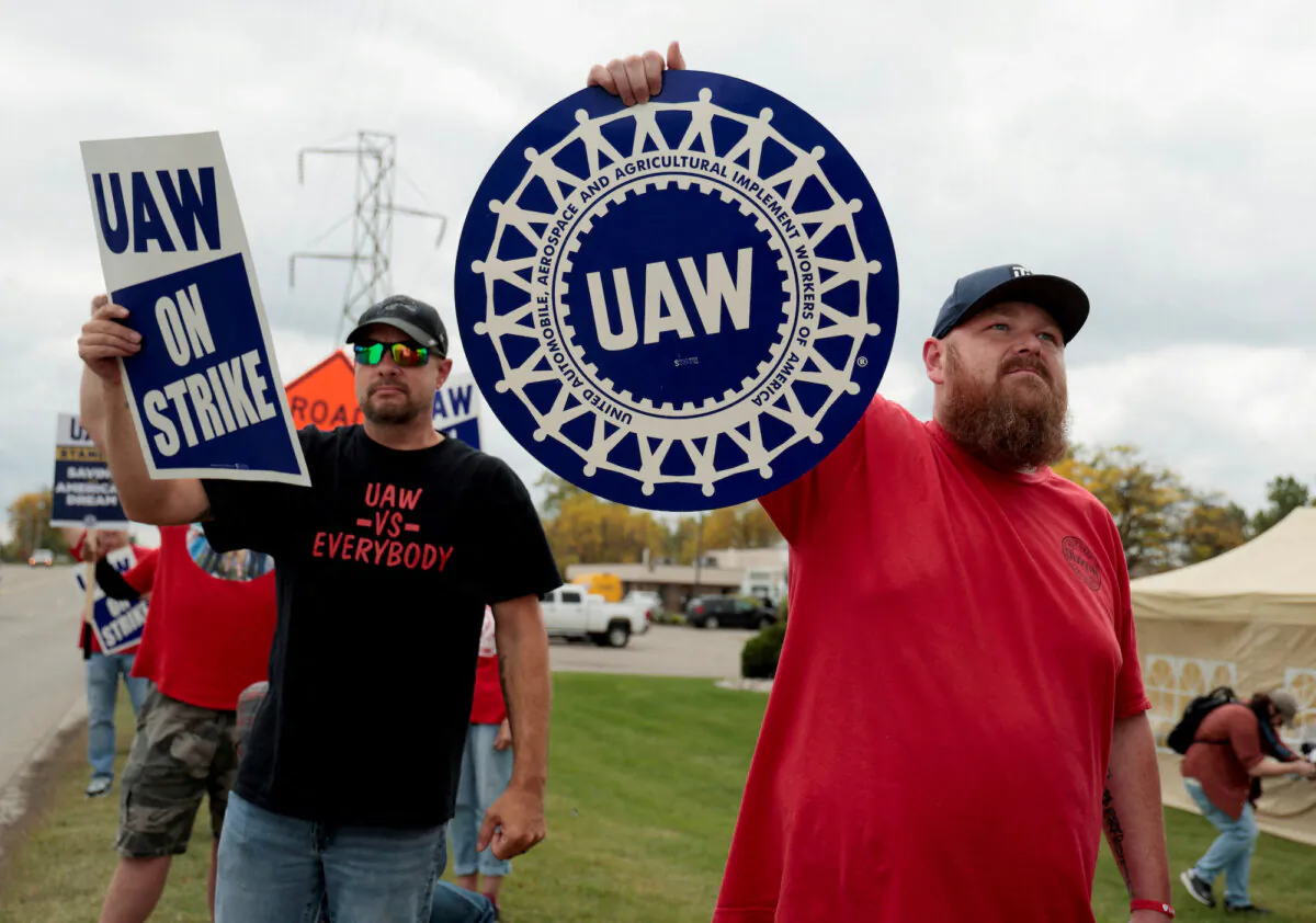 Striking United Auto Workers (UAW) members from the General Motors Lansing Delta Plant picket in Delta Township, Mich., on Sept. 29, 2023. (Rebecca Cook/Reuters)