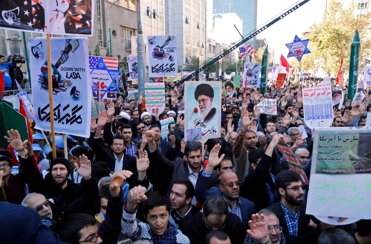 Iranians hold anti-America banners outside the former U.S. Embassy in the Iranian capital Tehran on Nov. 3, 2016. (Atta Kenare/AFP via Getty Images)