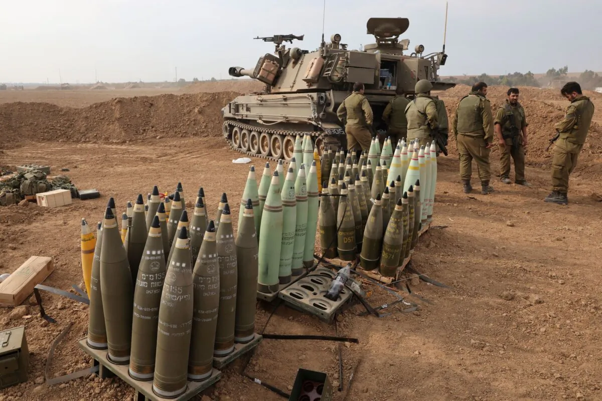 Artillery shells are lined up next to an armoured vehicle as Israeli soldiers take positions near the border with Gaza in southern Israel on Oct. 9, 2023. (Jack Guez/AFP via Getty Images)