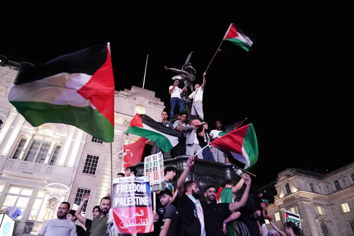 People in a Palestine Solidarity Campaign demonstration in Piccadilly Circus, London, dated Oct. 9, 2023. (Jordan Pettitt/PA Wire)