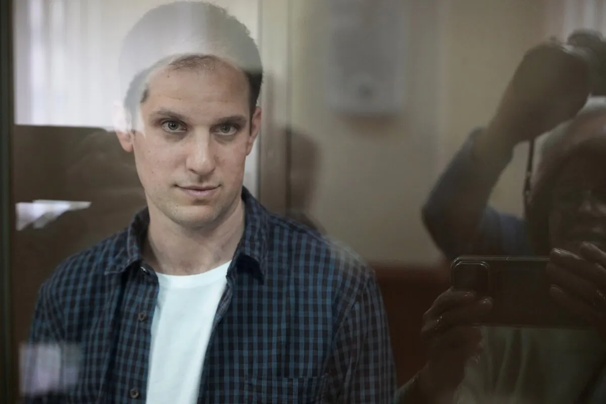 Wall Street Journal reporter Evan Gershkovich stands in a glass cage in a courtroom at the Moscow City Court in Moscow on Oct. 10, 2023. (Alexander Zemlianichenko/AP Photo)