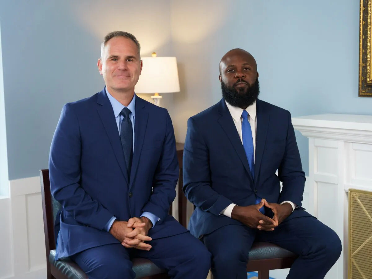 Chris Pilkerton (L) and Ja'ron Smith, co-authors of "Underserved: Harnessing the Principles of Lincoln's Vision for Reconstruction for Today's Forgotten Communities," in Washington on Aug. 28, 2023. (Alejandro Heredia/The Epoch Times)