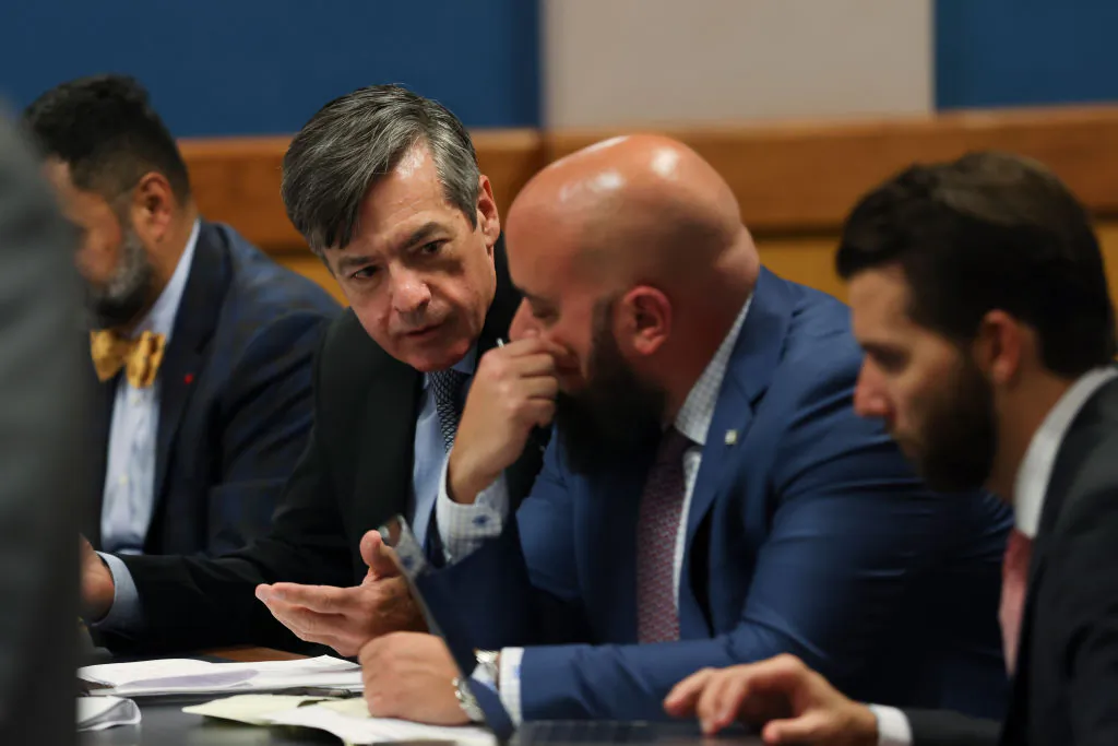 Kenneth Chesebro, a lawyer who worked in connection with former U.S. President Donald Trump's 2020 reelection campaign, speaks to his attorney Scott Grubman as he appears before Judge Scott McAfee in a hearing related to the 2020 election interference case in Fulton County Superior Court in Atlanta, Ga., on Oct. 10, 2023. (Alyssa Pointer-Pool/Getty Images)