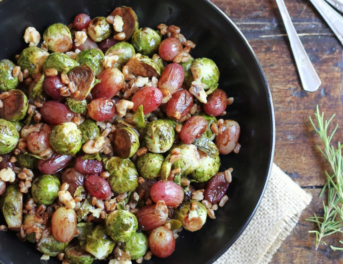 This hearty bowl tosses Brussels sprouts with grapes, toasted walnuts, and a cooked grain. (Lynda Balslev for Tastefood)