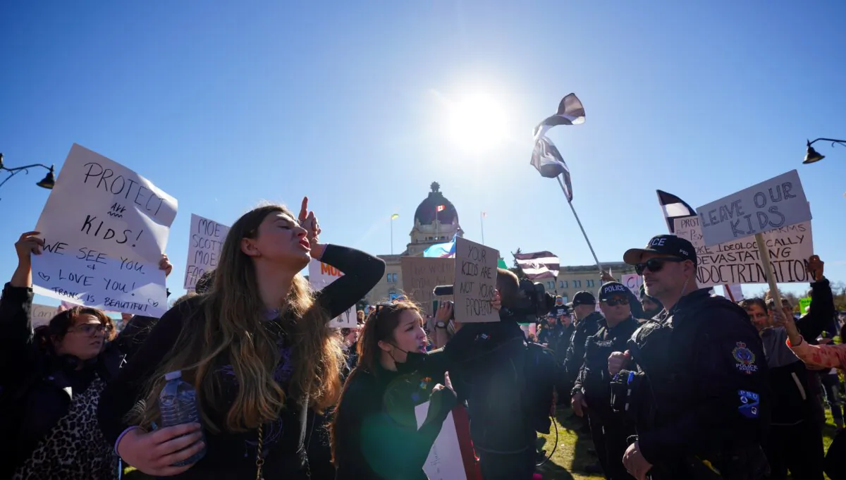 People attend competing rallies over Saskatchewan's pronoun bill outside the legislature in Regina on Oct. 10, 2023. (The Canadian Press/Heywood Yu)