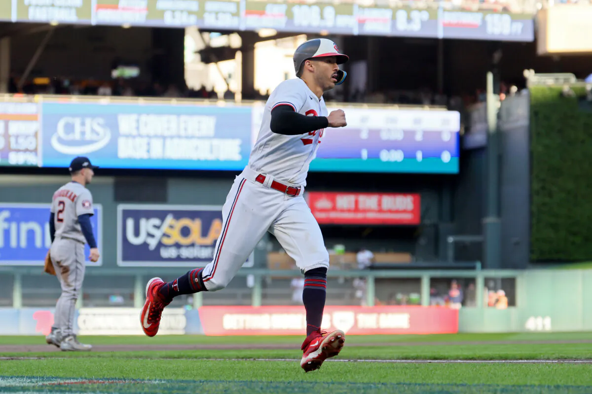 Carlos Correa (4) of the Minnesota Twins runs to home plate to score a run in the sixth inning against the Houston Astros during Game Three of the Division Series at Target Field in Minneapolis on Oct. 10, 2023. (Adam Bettcher/Getty Images)