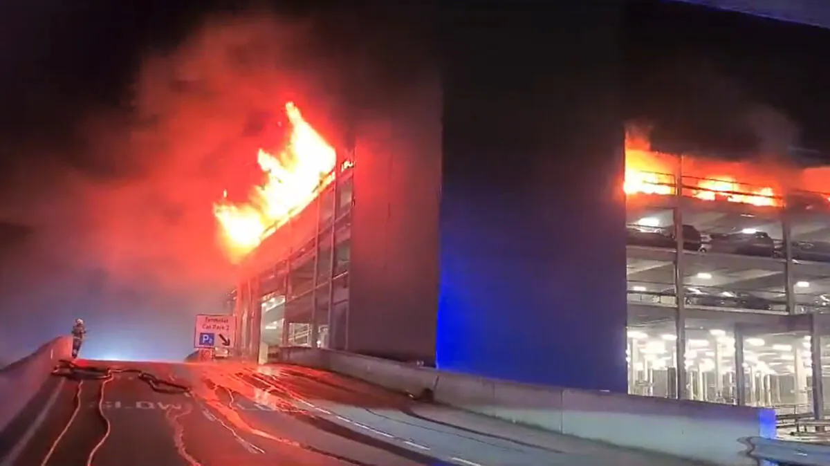 Screen grab from video issued by Bedfordshire Fire and Rescue Service of a fire at a car park at Luton Airport outside of London on Oct. 10, 2023. (Bedfordshire Fire and Rescue Service via PA)