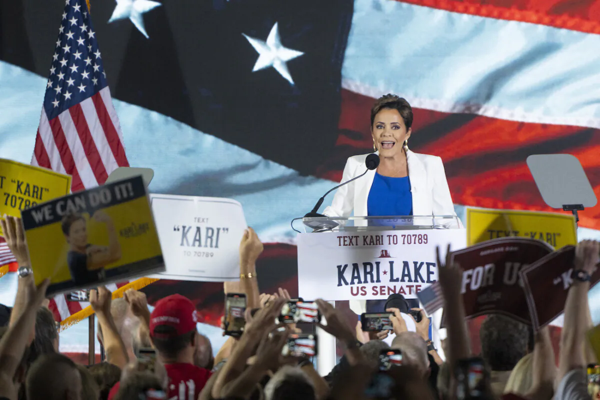 Former Arizona Republican gubernatorial candidate Kari Lake takes the stage to announce her bid for the seat of Sen. Kyrsten Sinema (I-Ariz.) at JetSet Magazine in Scottsdale, Ariz., on Oct. 10, 2023. (Rebecca Noble/Getty Images)