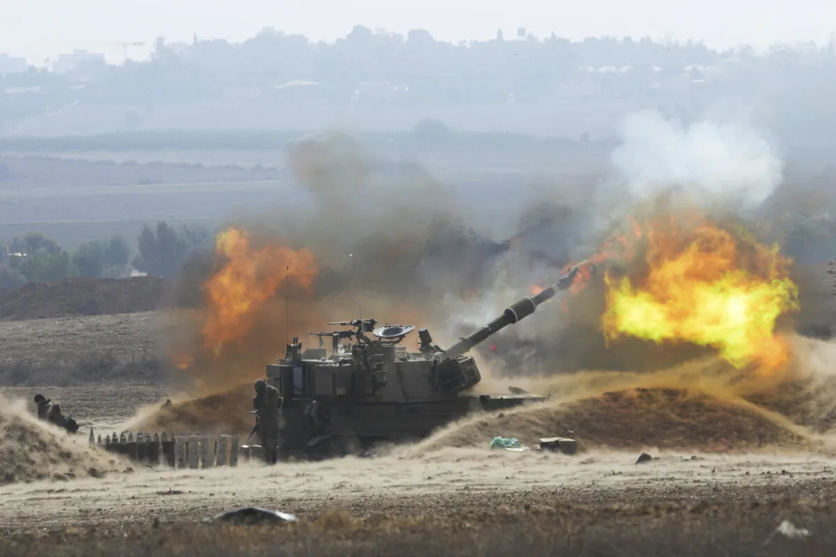 An Israeli mobile artillery unit fires a shell from southern Israel toward the Gaza Strip, near the Israel-Gaza border, on Oct. 11, 2023. (AP Photo/Erik Marmor)