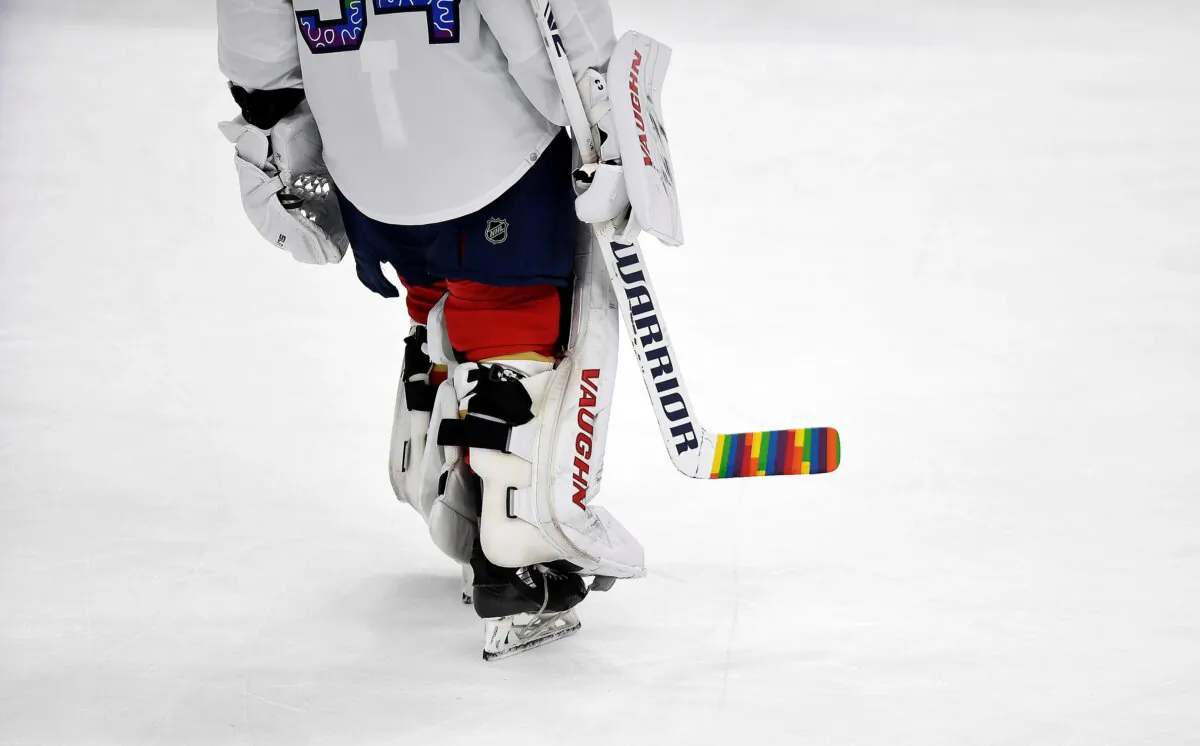 Florida Panthers goaltender Alex Lyon (34) warms up while celebrating Pride Night with a colorful hockey stick before playing the Toronto Maple Leafs in Sunrise, Fla., on March 23, 2023. (Michael Laughlin/AP Photo)