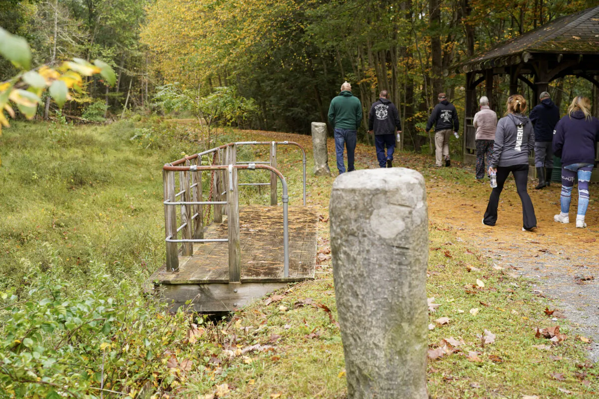 A guided walk along the dried-up Delaware and Hudson Canal in Cuddebackville, N.Y., on Oct. 8, 2023. (Cara Ding/The Epoch Times)