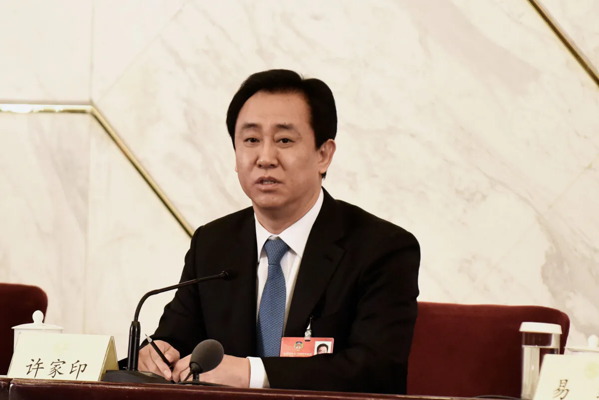 Xu Jiayin, Chairman of the Board of Evergrande Group, speaks during a news conference on the sidelines of the fourth session of the 12th National People's Congress, in Beijing, on March 6, 2016. (Etienne Oliveau/Getty Images)