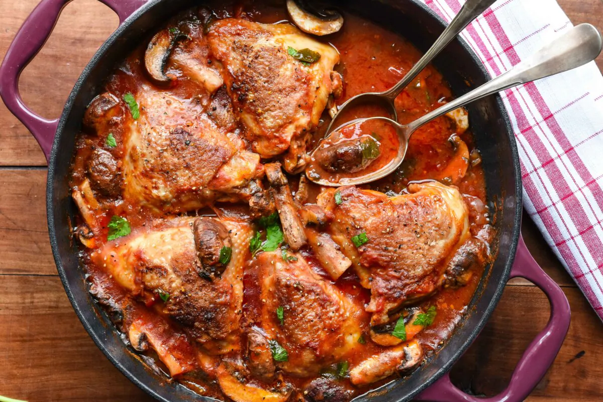 Bronzed chicken thighs are braised with tomatoes and white wine and brightened with orange zest in this hearty, saucy stew. (Audrey Le Goff)
