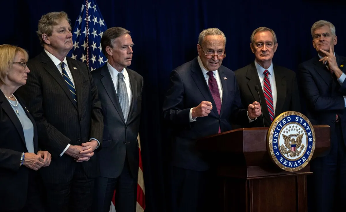 Senate Majority Leader Chuck Schumer (D-N.Y.) speaks at a news conference with (L-R) Sen. Maggie Hassan (D-N.H.), Sen. John Kennedy (R-La), U.S. Ambassador to China Nicholas Burns, Sen. Mike Crapo(R-Idaho), and Sen. Bill Cassidy (R-La.) in Beijing on Oct. 9, 2023. (Kevin Frayer/Getty Images)