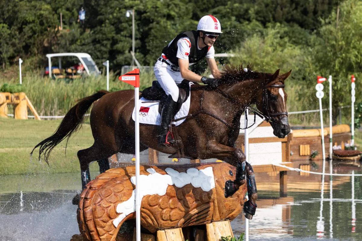 China's Alex Hua Tian riding Don Geniro competes in the equestrian's eventing team and individual cross country during the Tokyo 2020 Olympic Games at the Sea Forest Cross Country Course in Tokyo on Aug. 1, 2021. (Yuki Iwamura /AFP via Getty Images)