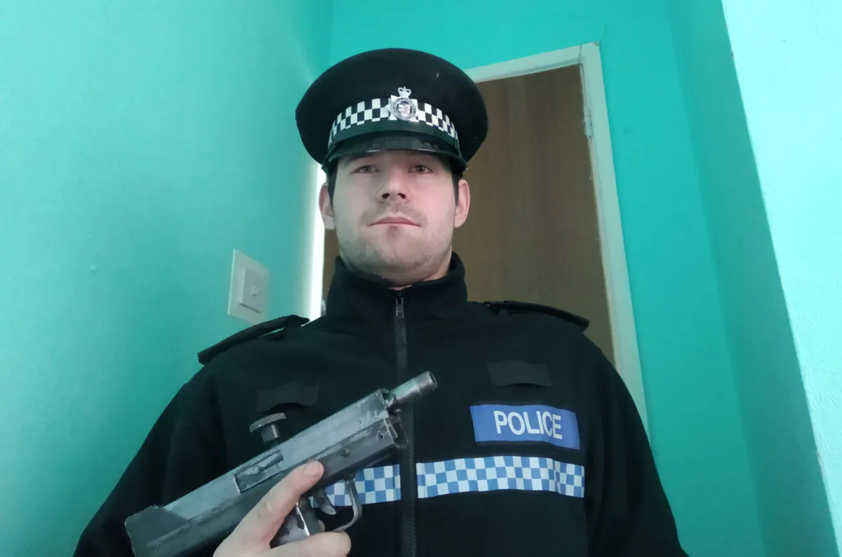 An undated image of Reed Wischhusen wearing a fake police uniform at his home in Wick St. Lawrence, Somerset. (Avon and Somerset Police)