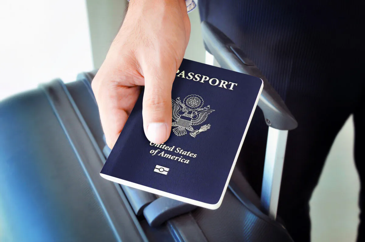 A person hold a U.S. passport. (Dreamstime/TNS)
